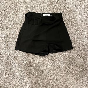 Black belted shorts.